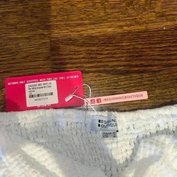 I’m selling a white strapless dress with tags still on. - Picture 3 of 3